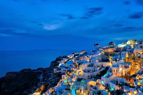 Famous greek iconic picturesque tourist destination Oia village with traditional white houses and