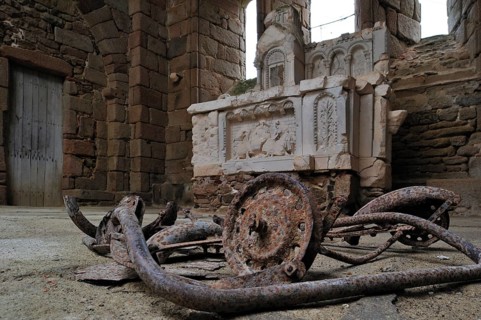 Burnt pram and altar in the church. The burnt village of Oradour-sur-Glane was destroyed on 10 June