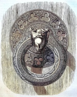 A finely chiselled iron ring, door handle on one of the inner doors of Bourges Cathedral, France,
