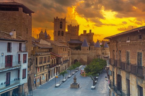 Incredible sunrise of the Royal Palace of the medieval town of Olite from above, in the south of