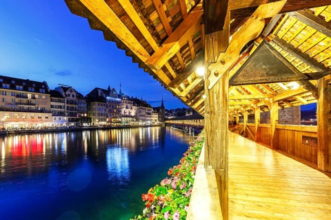 Chapel Bridge town on the river Reuss with bridge at night in Lucerne, Switzerland, Europe