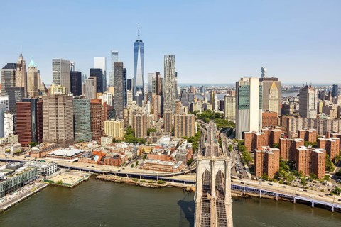 New York City skyline of Manhattan with World Trade Centre skyscraper and Brooklyn Bridge aerial