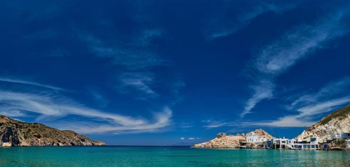 Panorama of the beach and fishing village of Firapotamos in Milos island, Greece, Europe