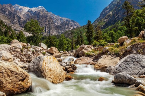 Mountain stream with waterfall cascades in Himalayas. Sangla valley, Himachal Pradesh, India, Asia