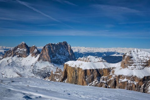 View of a ski resort piste and Dolomites mountains in Italy from Passo Pordoi pass. Arabba, Italy,