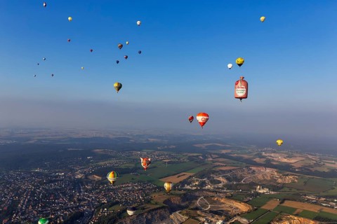 Many different hot air balloons in the blue sky, advertising, logo, hot air balloon festival, 26th
