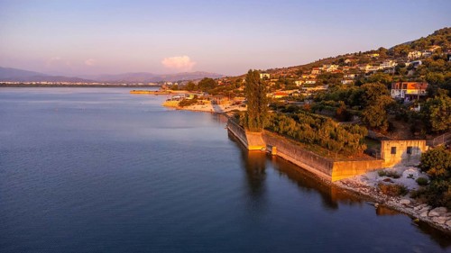 Aerial drone view of the beautiful landscape of Shiroka Lake at sunset near Shkoder. Albania