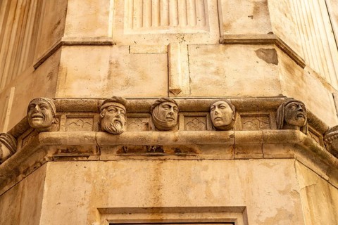 Famous heads on the façade of the Cathedral of St James, UNESCO World Heritage Site in Sibenik,