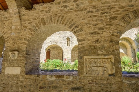 Tomb panels and inner courtyard at the cloister of Saint Martin du Canigou Abbey, Casteil,