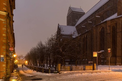 St Nicholas' Church and Frische Grube canal in the snow and at night, Hanseatic city of Wismar,