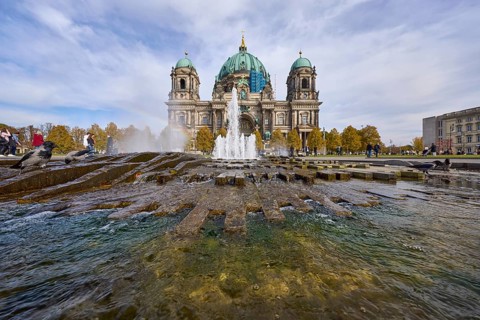 Fountain in the Lustgarten from the frog's perspective and the Berlin Cathedral, Berlin, capital