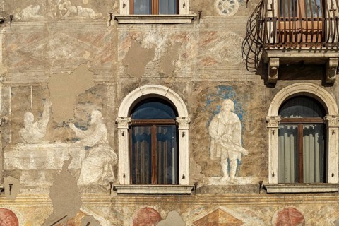The painted façade of the Case Cazuffi Rella houses on Piazza del Duomo in Trento, Trentino, Italy,