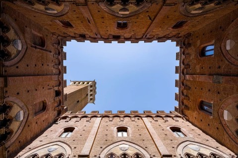 Upwards view of Torre del Mangia from inside Palazzo Pubblico, Siena, Tuscany, Italy, Europe