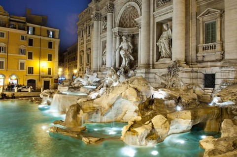 Night shot with long exposure photo side view of sculptures in Trevi Fountain Fontana di Trevi with