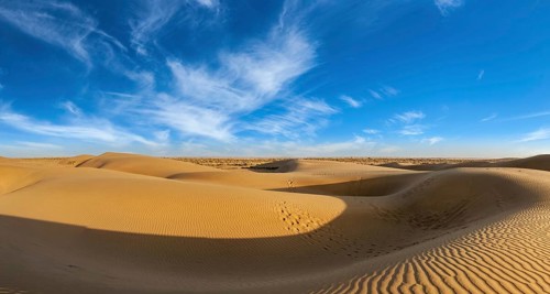 Panorama of dunes landscape with dramatic clouds in Thar Desert. Sam Sand dunes, Rajasthan, India,