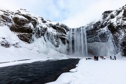 Skogafoss waterfall, snowy and icy rock face, Sudurland, Iceland, Europe