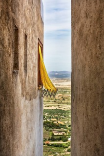 Typical narrow alley with view of the surrounding countryside from above, old town of Mojácar,