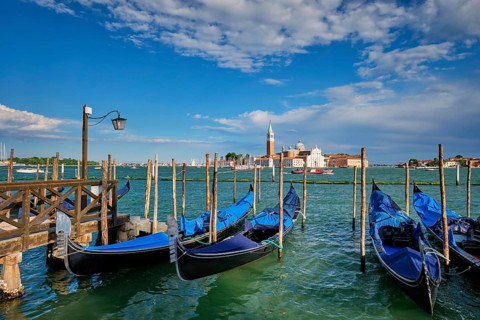 Gondolas and in lagoon of Venice by Saint Mark (San Marco) square with San Giorgio di Maggiore