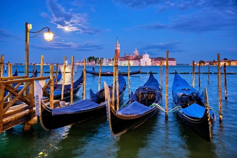 Romantic vacation Venice travel background, gondolas at Saint Mark (San Marco) square and Basilica