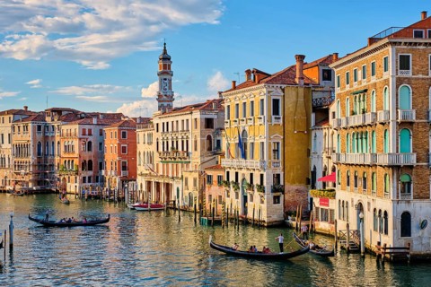 VENICE, ITALY, JUNE 27, 2018: Grand Canal with boats and gondolas on sunset, Venice, Italy, Europe