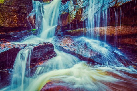 Vintage retro effect filtered hipster style image of tropical waterfall. Popokvil Waterfall, Bokor