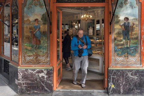 Elderly gentleman comes from a traditional bakery, built around 1900, Paris, France, Europe