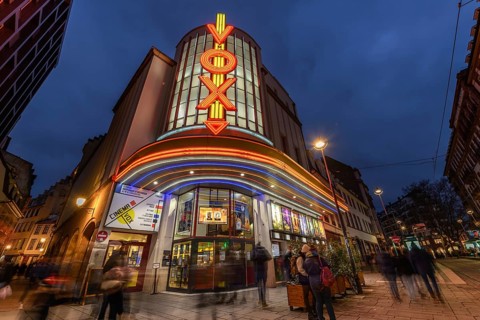 The Vox cinema in Strasbourg is illuminated at night. Bas-Rhin, Alsace, Grand Est, France, Europe