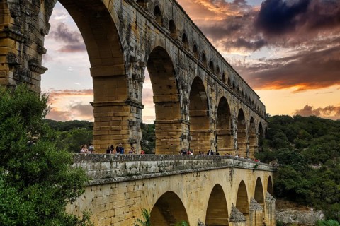 Pont du Gard, Roman aqueduct over the river Gardon, evening sky, Languedoc-Roussillon, South of