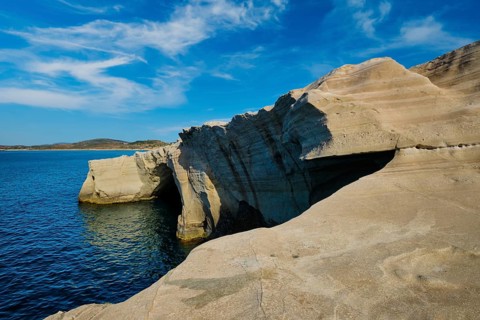 White rocks of famous tourist attraction of Milos island Sarakiniko beach and Aegean sea, Milos