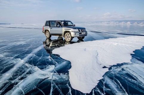 Car on the ice of Lake Baikal, Olkhon Island, Pribaikalsky National Park, Irkutsk Province,