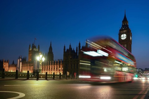 Red double-decker bus on Westminster Bridge, blue hour, Big Ben in the background, Westminster,