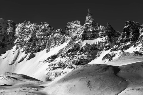 Snow-covered peaks of the Öxnadalur mountain range, near Akureyri, black and white photo, Northern