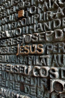 Inscription "Jesus" on the portal of the Passion façade of the Sagrada Familia, Holy Family Church
