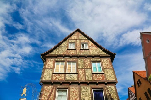 Half-timbered house, former Tübinger Tor inn, facade painting, window, inn sign, image of the