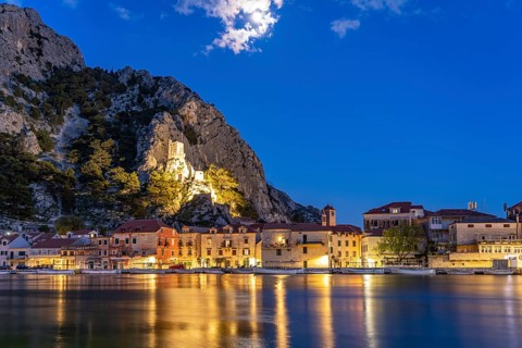 The old town centre of Omis on the river Cetina with the ruins of the Mirabella fortress or Peovica