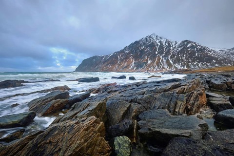 Rocky coast of fjord of Norwegian sea in winter. Lofoten islands, Norway, Europe