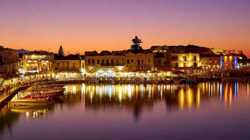 Venetian harbour, dusk, night shots, orange sky, colourful rows of houses, water reflection,