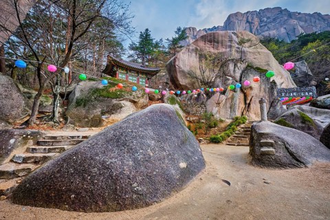 SEORAKSAN, SOUTH KOREA, APRIL 14, 2017: Kyejoam Seokgul Hermitage shrine and Ulsanbawi rock in