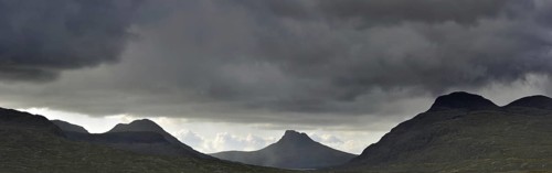 Highland scenery with rain clouds at Assynt, Sutherland, Scotland, UK