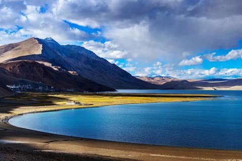 Himalayan lake Tso Moriri and Korzok village in Himalayas on sunset, Ladakh, India, Asia