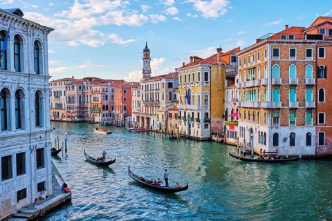 VENICE, ITALY, JUNE 27, 2018: Grand Canal with boats and gondolas on sunset, Venice, Italy, Europe