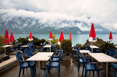 Empty restaurant, café, bad weather on the lake promenade at Lake Brienz, Brienz, Canton Bern,