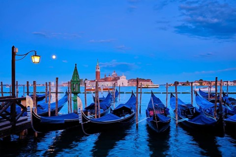 Romantic vacation Venice travel background, gondolas at Saint Mark (San Marco) square and Basilica
