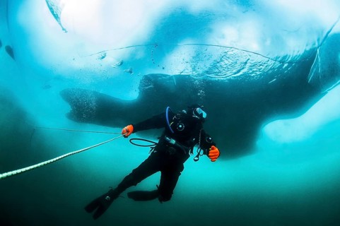 Scuba diver under the ice, Lake Baikal, Olkhon Island, Pribaikalsky National Park, Irkutsk