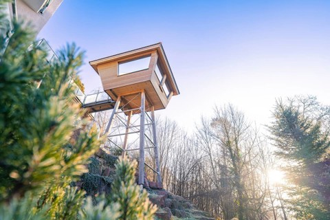 Modern tree house in natural surroundings with sunset in the background, Hotel Krone Lamm,