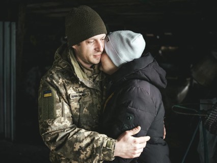A Ukrainian soldier says goodbye to his woman after a furlough, Hroza, Ukraine, Europe