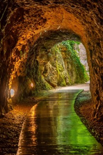 Trail in the Iris Grotto at the Cola de Caballo Waterfall in the Monasterio de Piedra Natural Park,