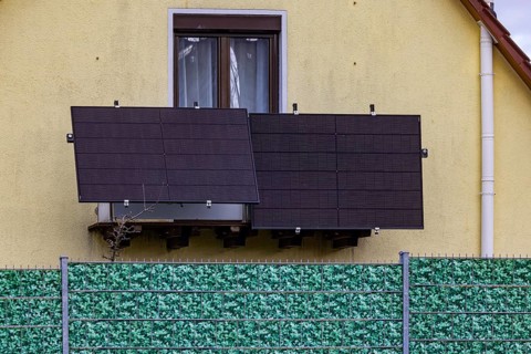 Plastic fence in leaf look on a detached house. Balcony power station. Stuttgart,