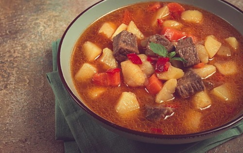 Meat goulash, with potatoes and carrots, sweet pepper, traditional Hungarian soup, homemade, no