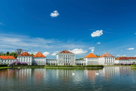 Swans in artificial pool in front of the Nymphenburg Palace. Munich, Bavaria, Germany, Europe